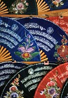 Northern Thai fans decorated with Arabic script.